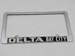Delta Ford Bay City Michigan Vintage Dealer License Plate Steel Frame Bezel. Fixed Price $79.96.